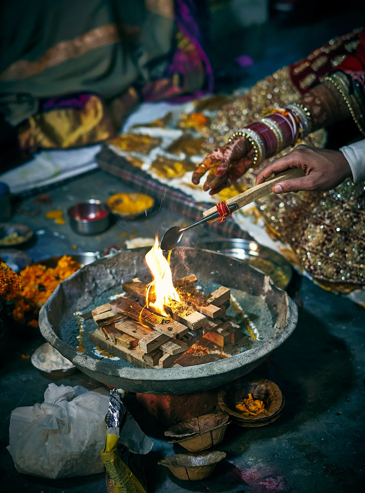 A bride’s hennaed hands during a wedding ceremony
